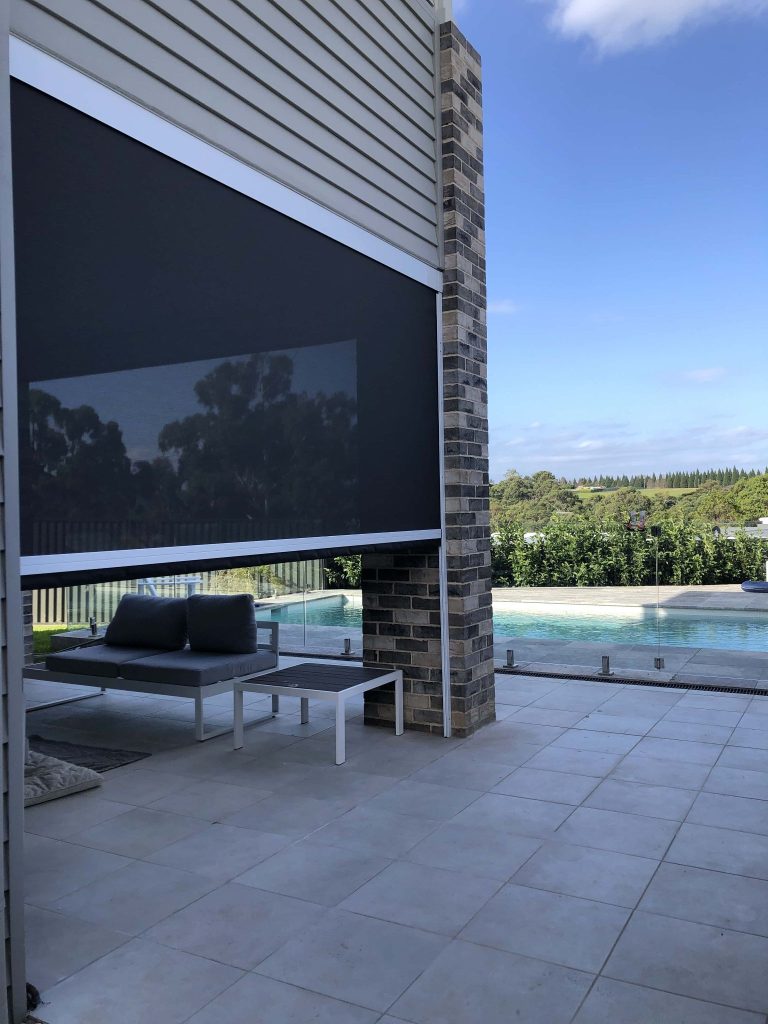 outdoor blinds and seating arrangement near pool