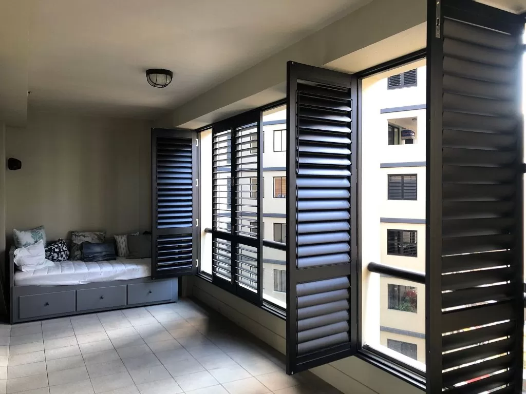 black outdoor plantation shutters in an apartment building