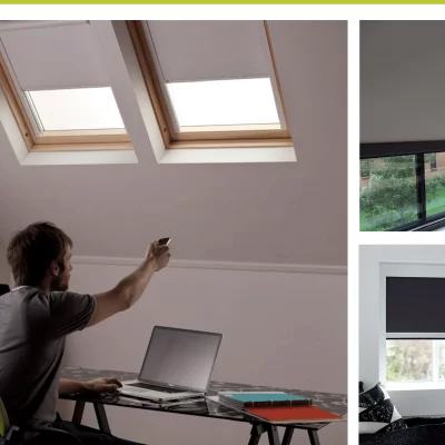 person sitting at a desk pointing a remote at blockout blinds