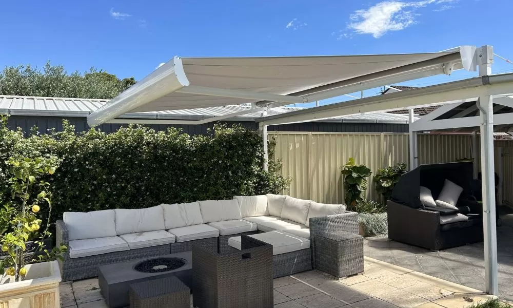 backyard with outdoor seating arrangement and retractable awning